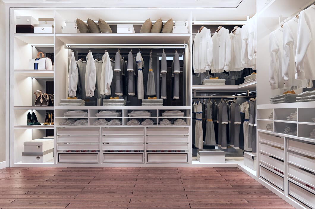 Custom walk-in closet with fitted hanging space, drawers and open shelving