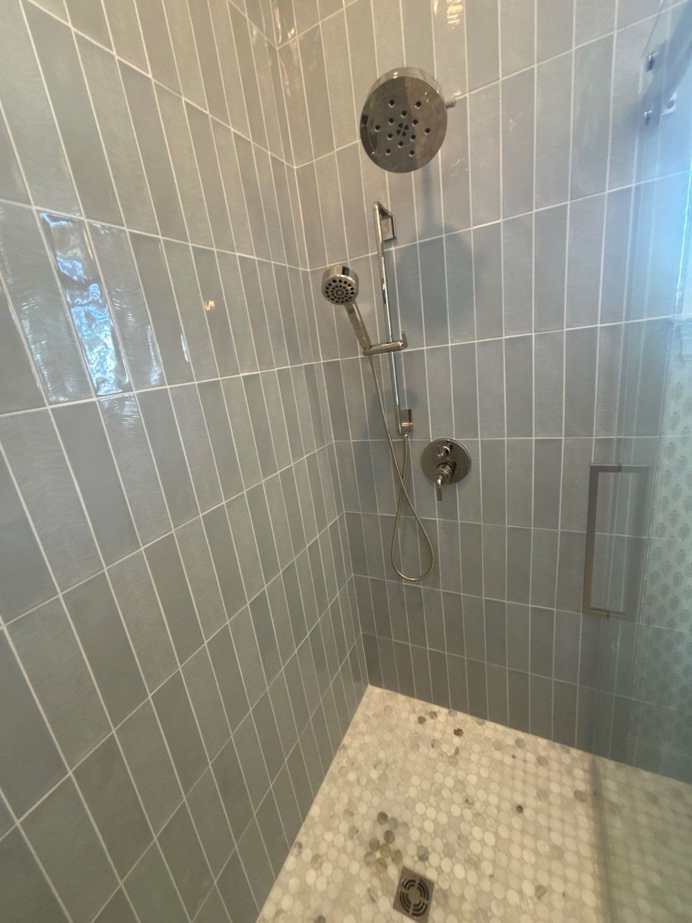 Tiled walk-in shower with glass enclosure in Palm Beach County
